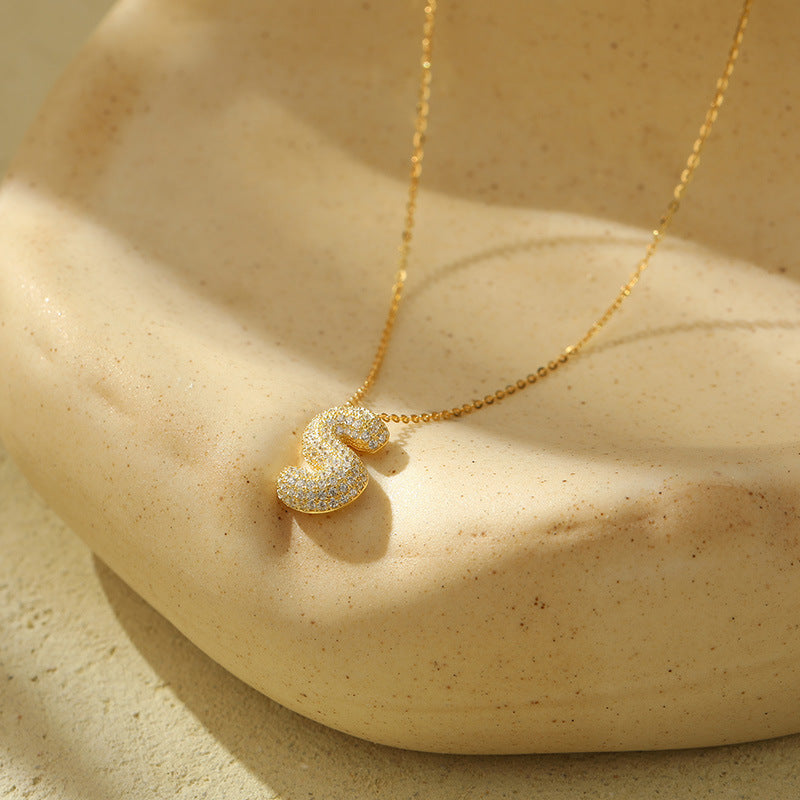 Collier initiale diamants