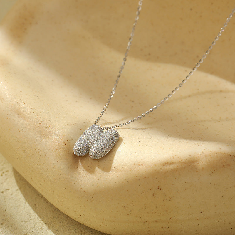 Collier initiale diamants