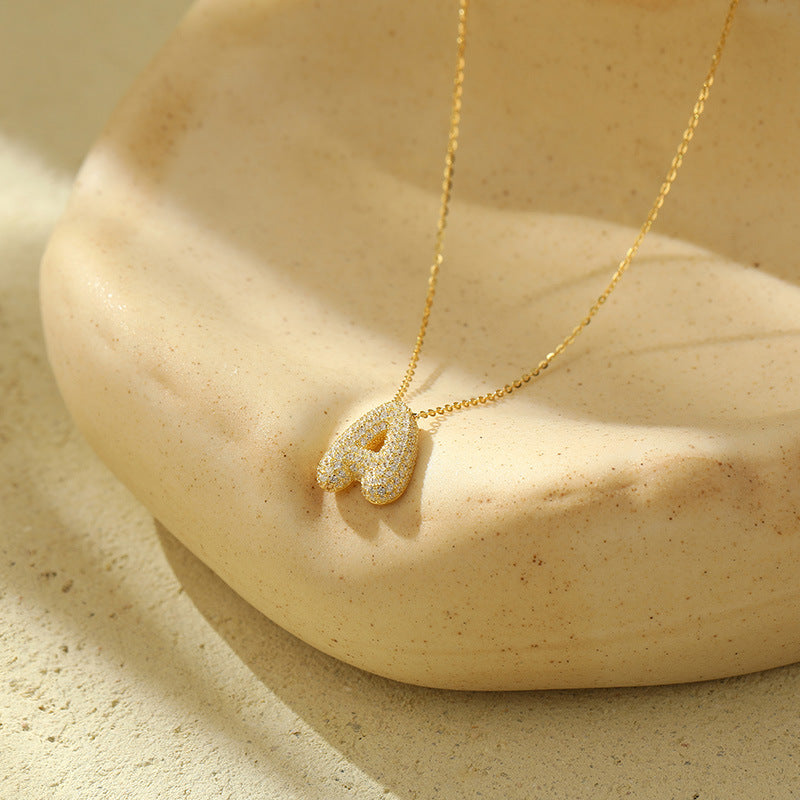 Collier initiale diamants