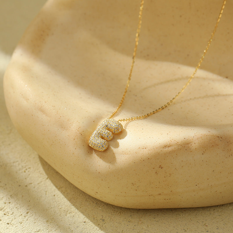 Collier initiale diamants