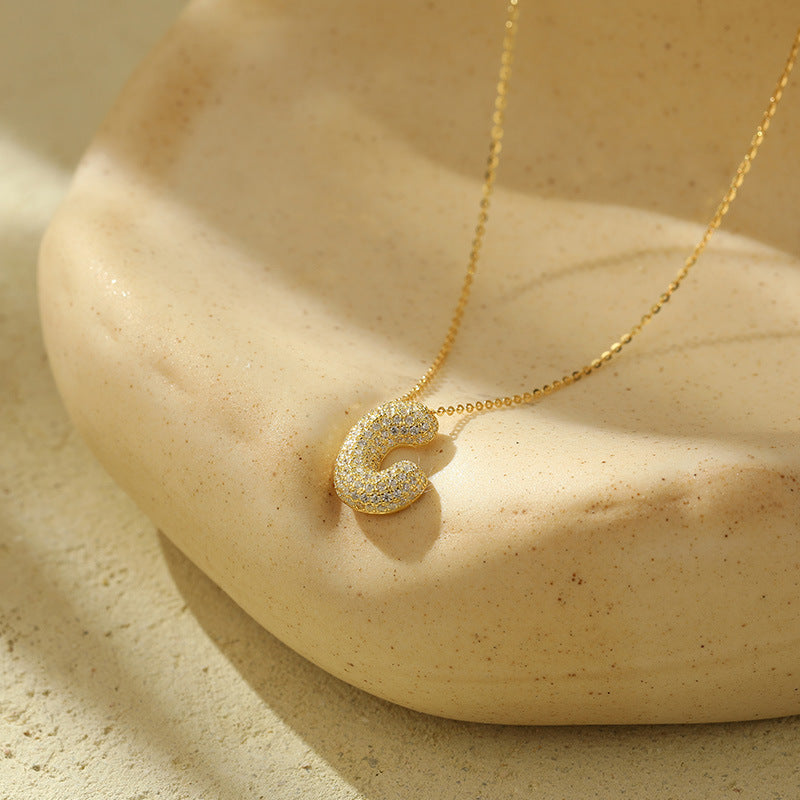 Collier initiale diamants