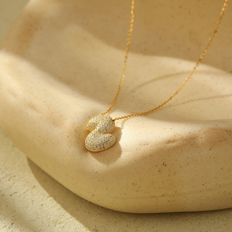 Collier initiale diamants