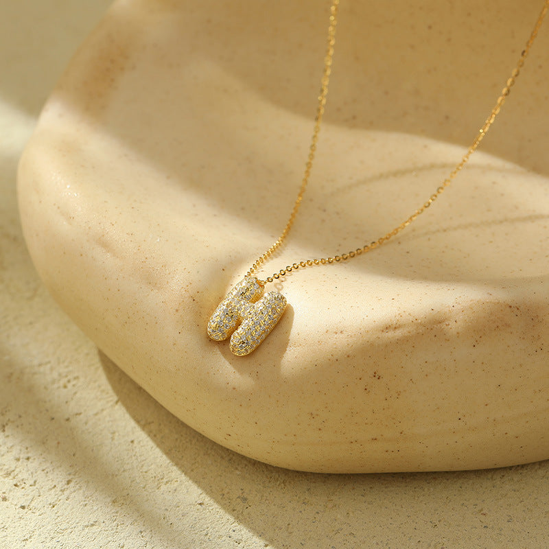 Collier initiale diamants