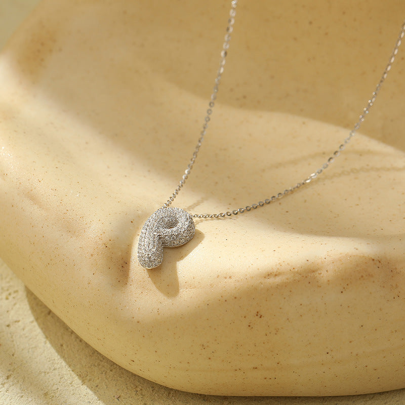 Collier initiale diamants