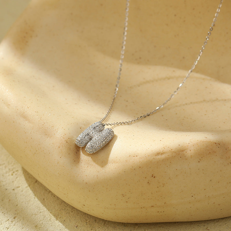 Collier initiale diamants