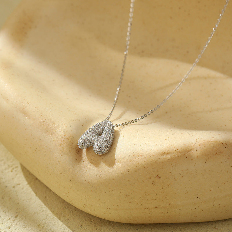 Collier initiale diamants