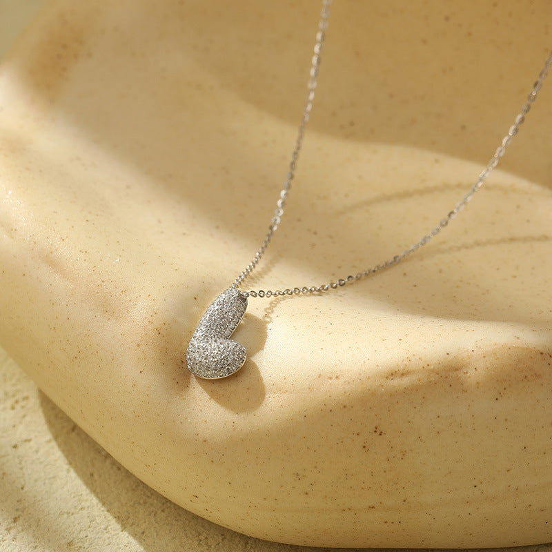 Collier initiale diamants