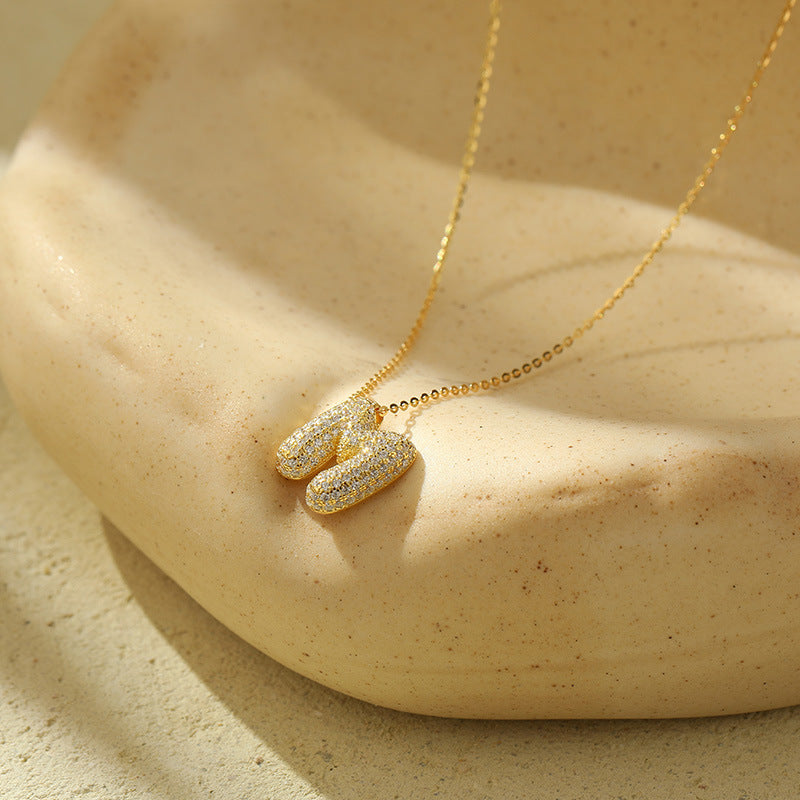 Collier initiale diamants