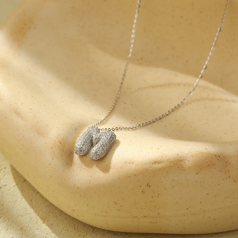 Collier initiale diamants