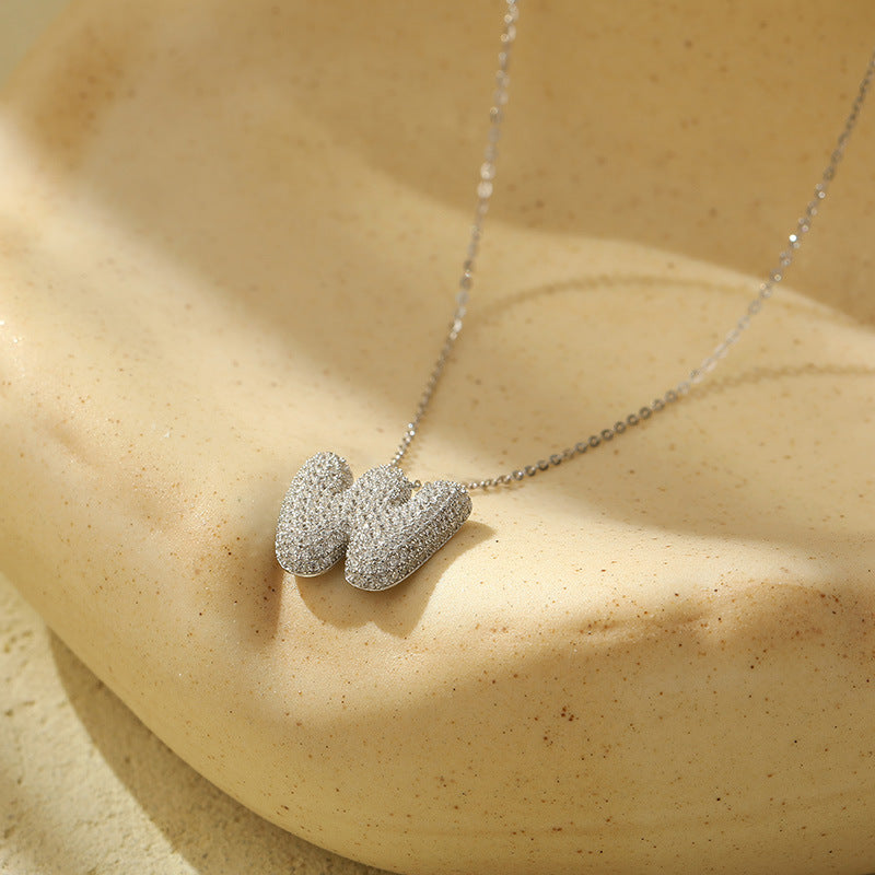 Collier initiale diamants