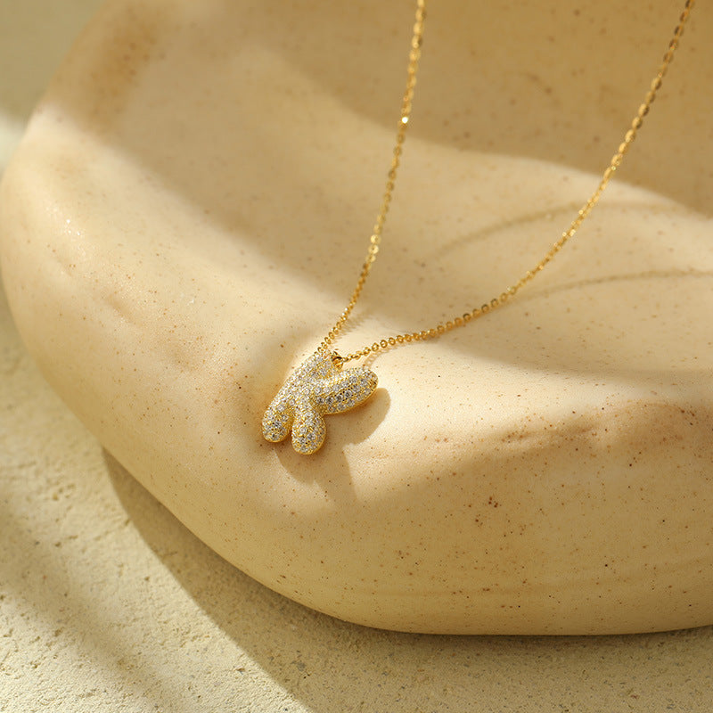 Collier initiale diamants